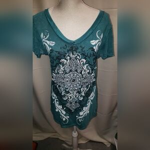 VOCAL Turquoise top with white scroll accents on front and back. Size Medium